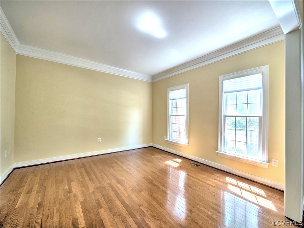 1024 Kingham Drive Midlothian, VA 23114 - Photo 10 of 41 an empty room with wooden floor and windows