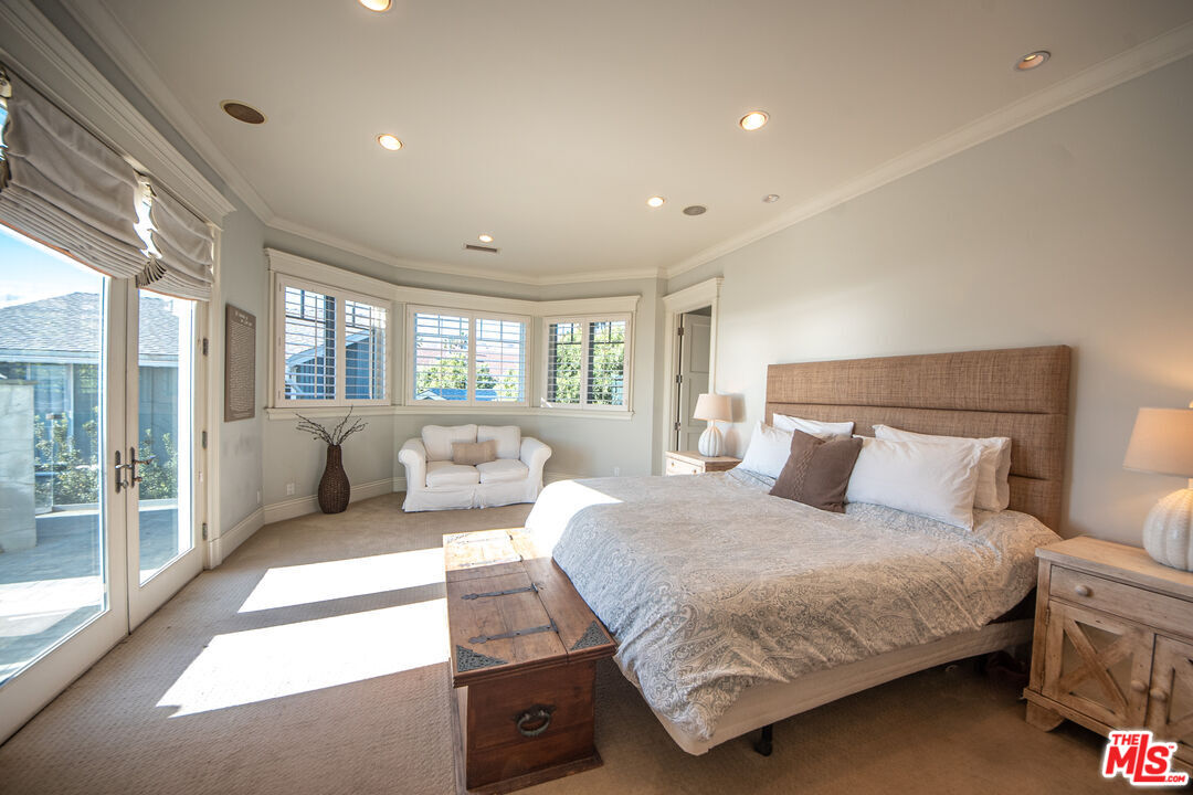 30760 Broad Beach Road Malibu, CA 90265 - Photo 12 of 41 a bedroom with a large bed and a couch