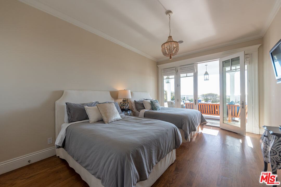 30760 Broad Beach Road Malibu, CA 90265 - Photo 26 of 41 a bedroom with double bed and a large window
