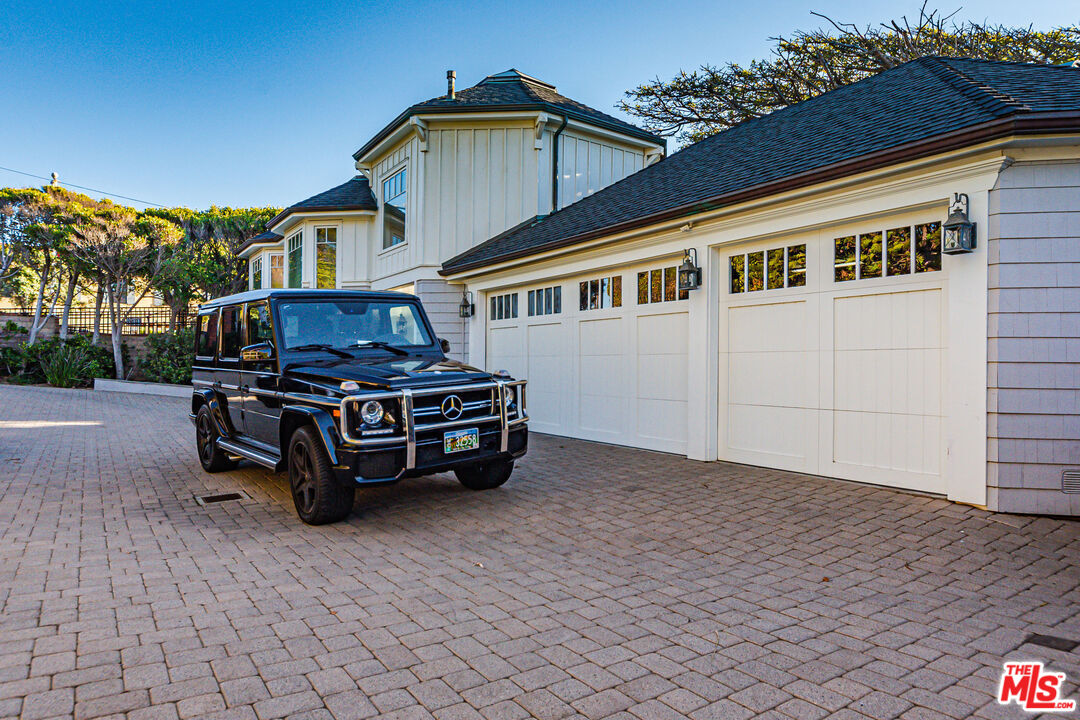 30760 Broad Beach Road Malibu, CA 90265 - Photo 40 of 41 a car parked in front of a house