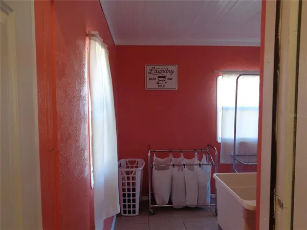 a view of a storage & utility room with a washer dryer