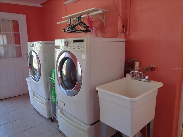 a utility room with dryer and washer