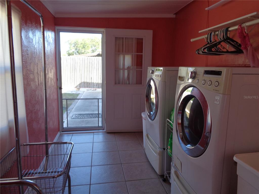88 Yale Avenue Frostproof, FL 33843 - Photo 34 of 39 a view of a storage & utility room with a washer dryer