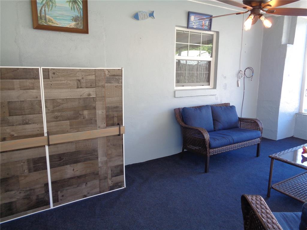 88 Yale Avenue Frostproof, FL 33843 - Photo 36 of 39 a living room with furniture and a window