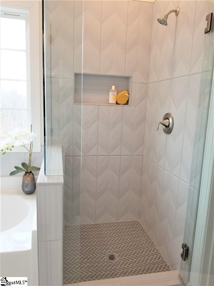 111 Foxfield Way Greer, SC 29651 - Photo 11 of 27 Master shower with beautiful tile work and glass doors. Located next to tub.