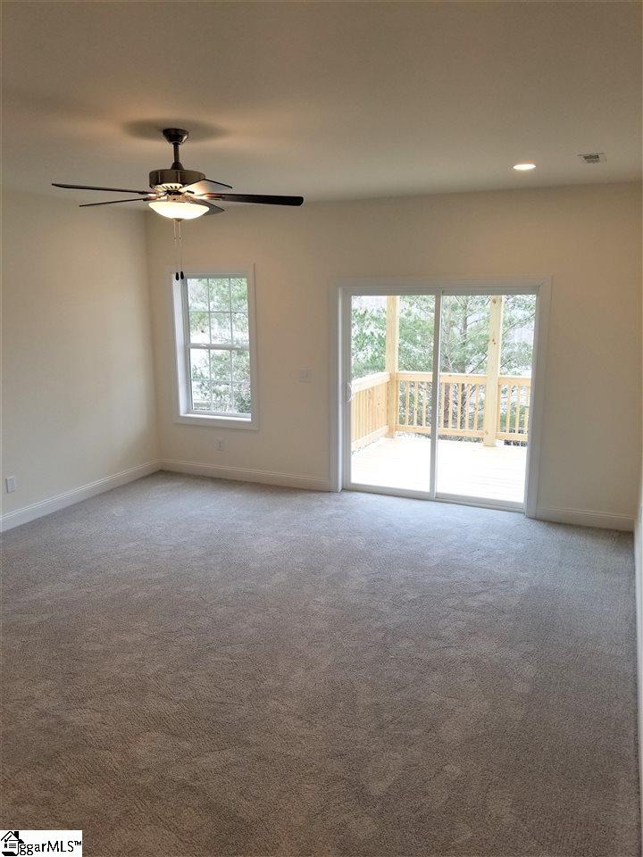 111 Foxfield Way Greer, SC 29651 - Photo 17 of 27 Basement family room with access through sliding door to lower wood 10x10 deck and backyard.