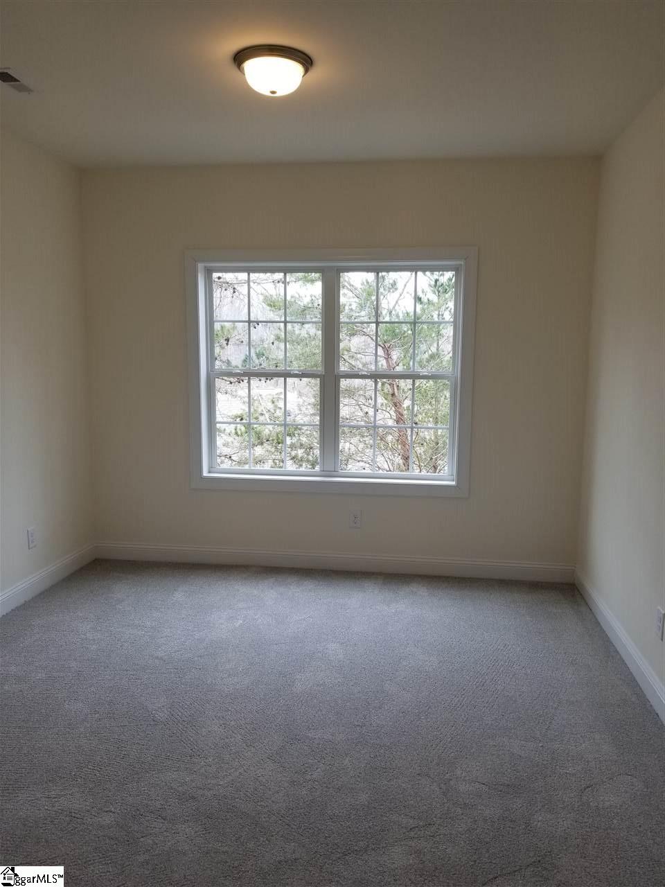 111 Foxfield Way Greer, SC 29651 - Photo 18 of 27 Bedroom with walk-in closet and view of backyard located in Basement.