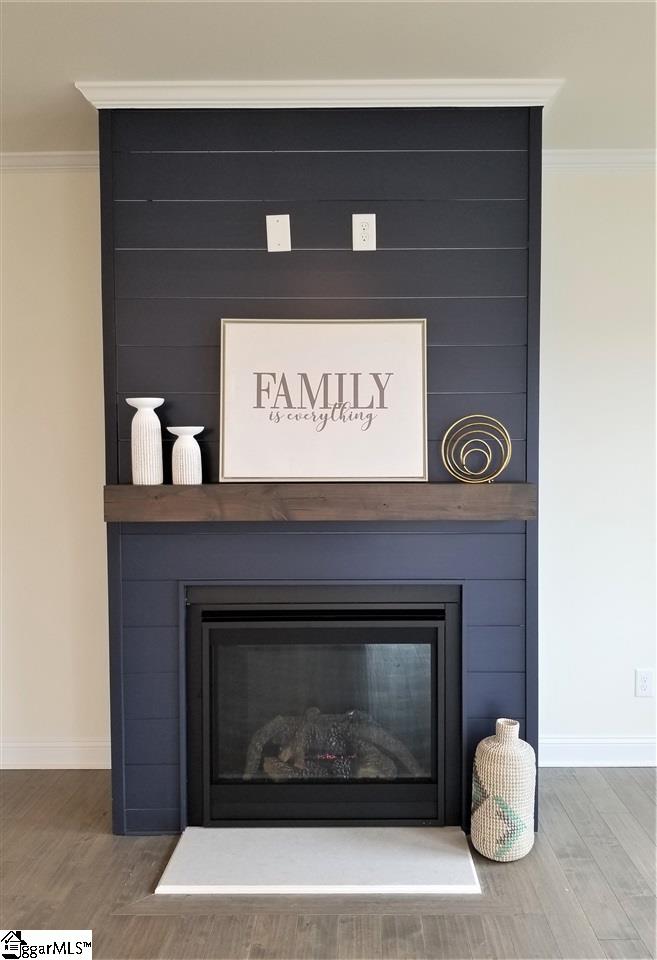 111 Foxfield Way Greer, SC 29651 - Photo 4 of 27 Shiplap painted a beautiful accent color that blends well with the kitchen backsplash.