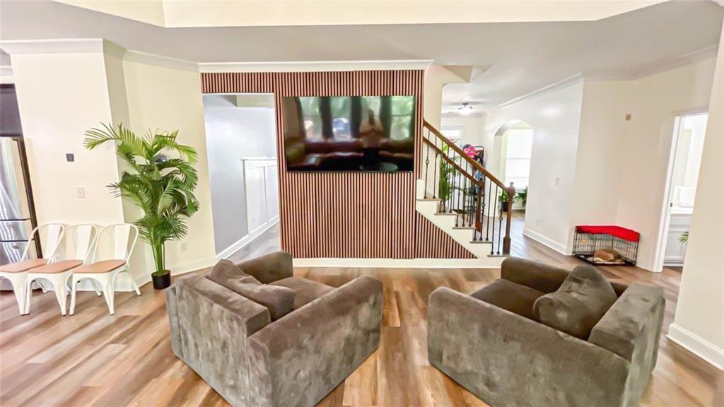 3281 Alhambra Circle Hampton, GA 30228 - Photo 23 of 88 a living room with furniture and a potted plant