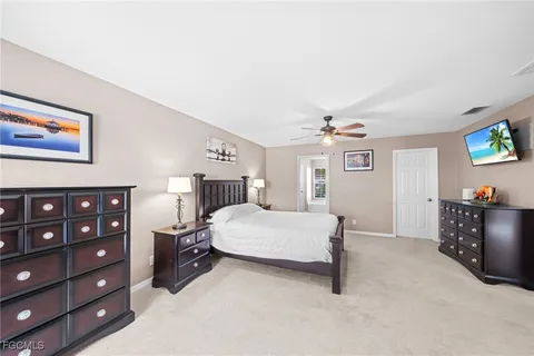 a spacious bathroom with a granite countertop sink mirror and a