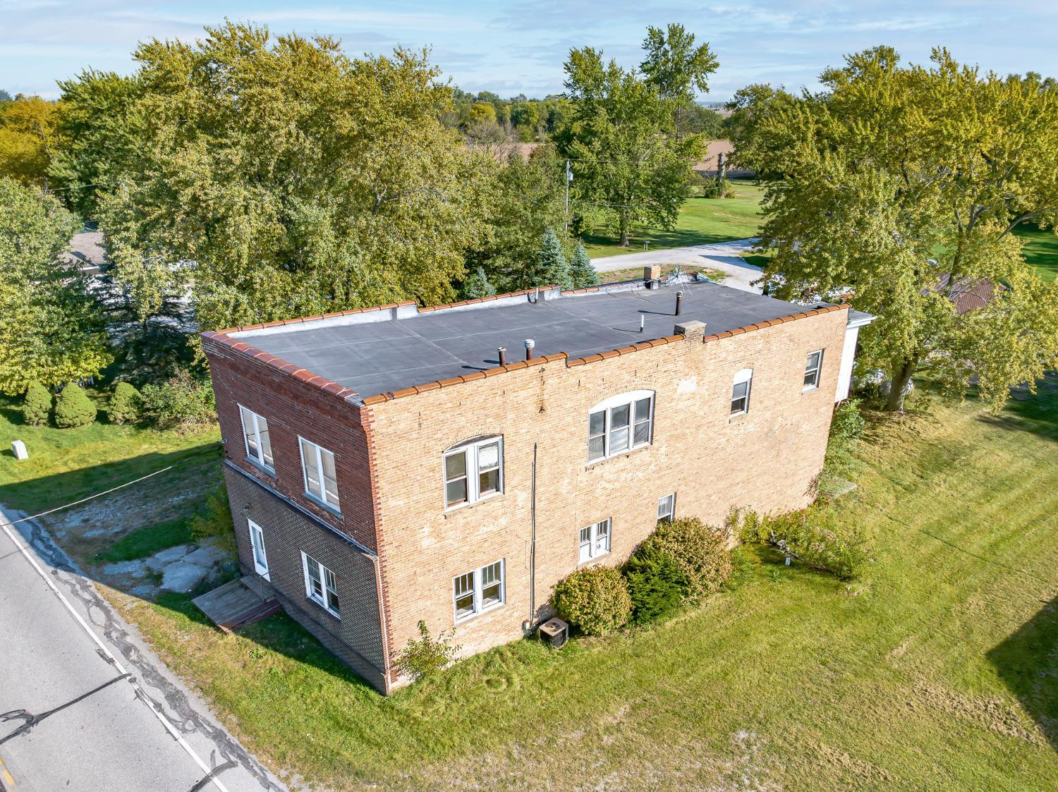 9907 Belshaw Road, Unit 3 Lowell, IN 46356 - Photo 17 of 62 a view of a house with a yard
