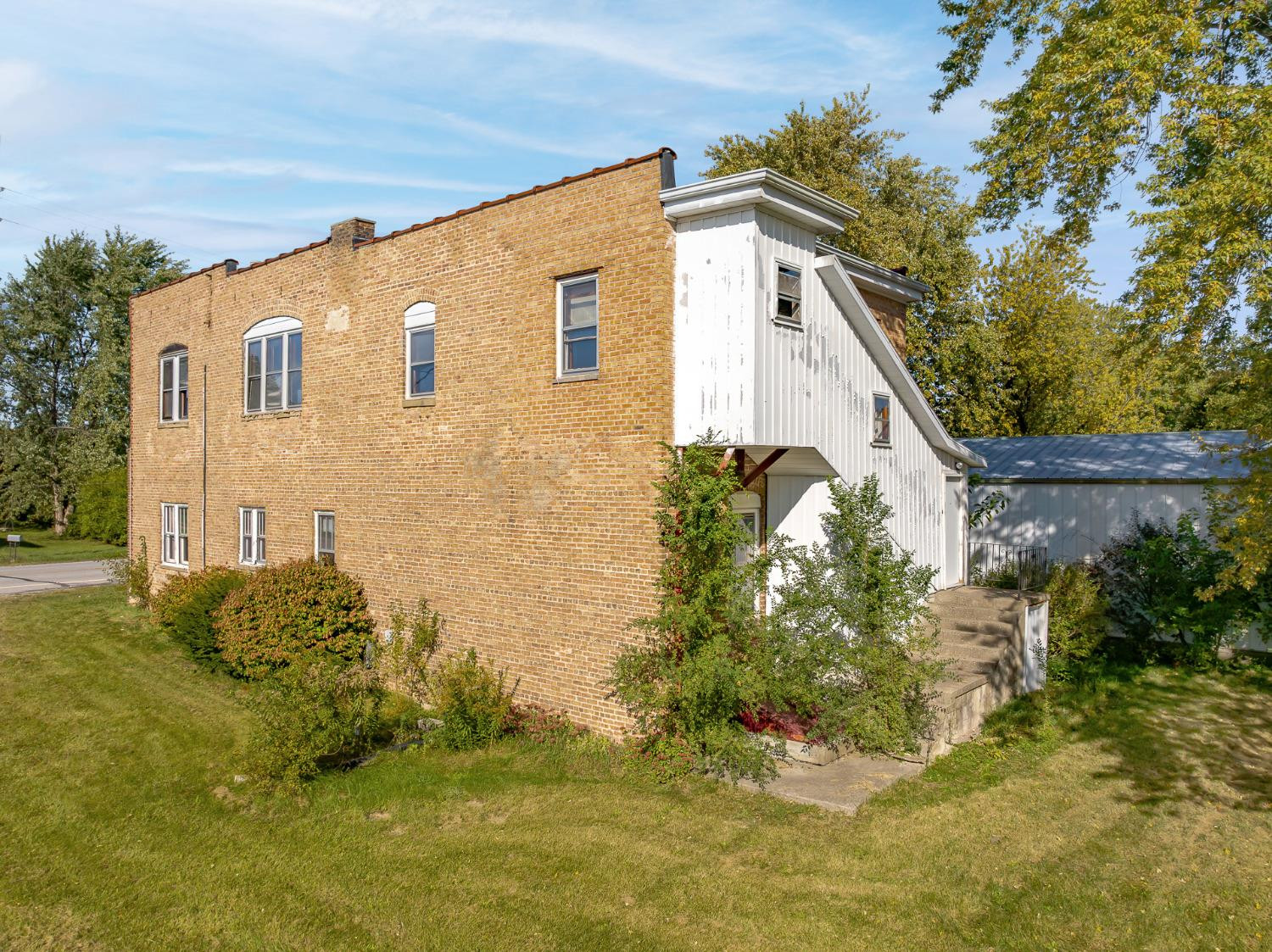 9907 Belshaw Road, Unit 3 Lowell, IN 46356 - Photo 54 of 62 a front view of a house with a yard