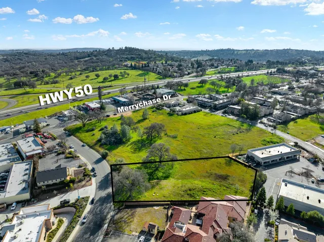 an aerial view of a houses with a swimming pool