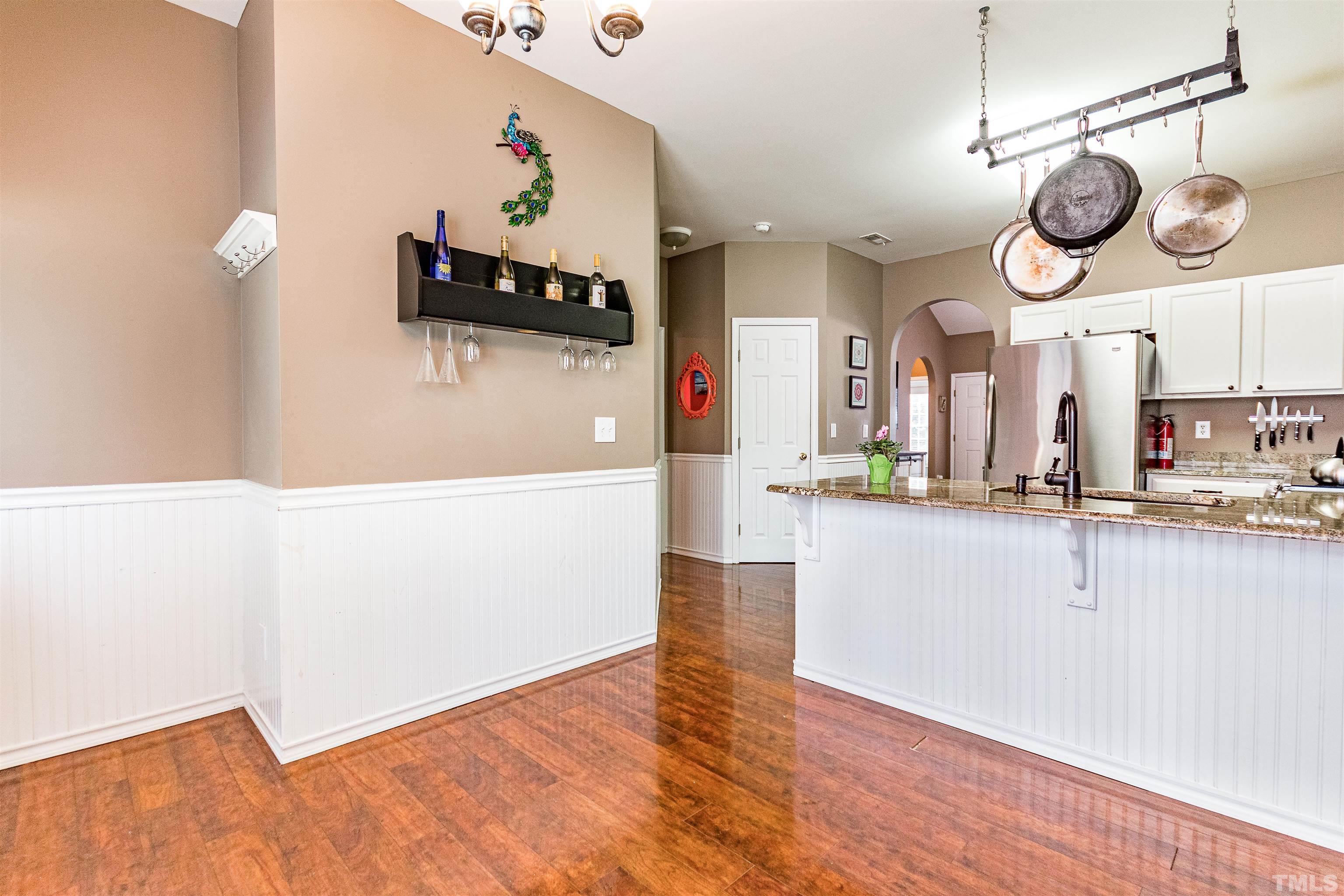 5405 Neuse Forest Road Raleigh, NC 27616 - Photo 14 of 31 an open kitchen view with wooden floor