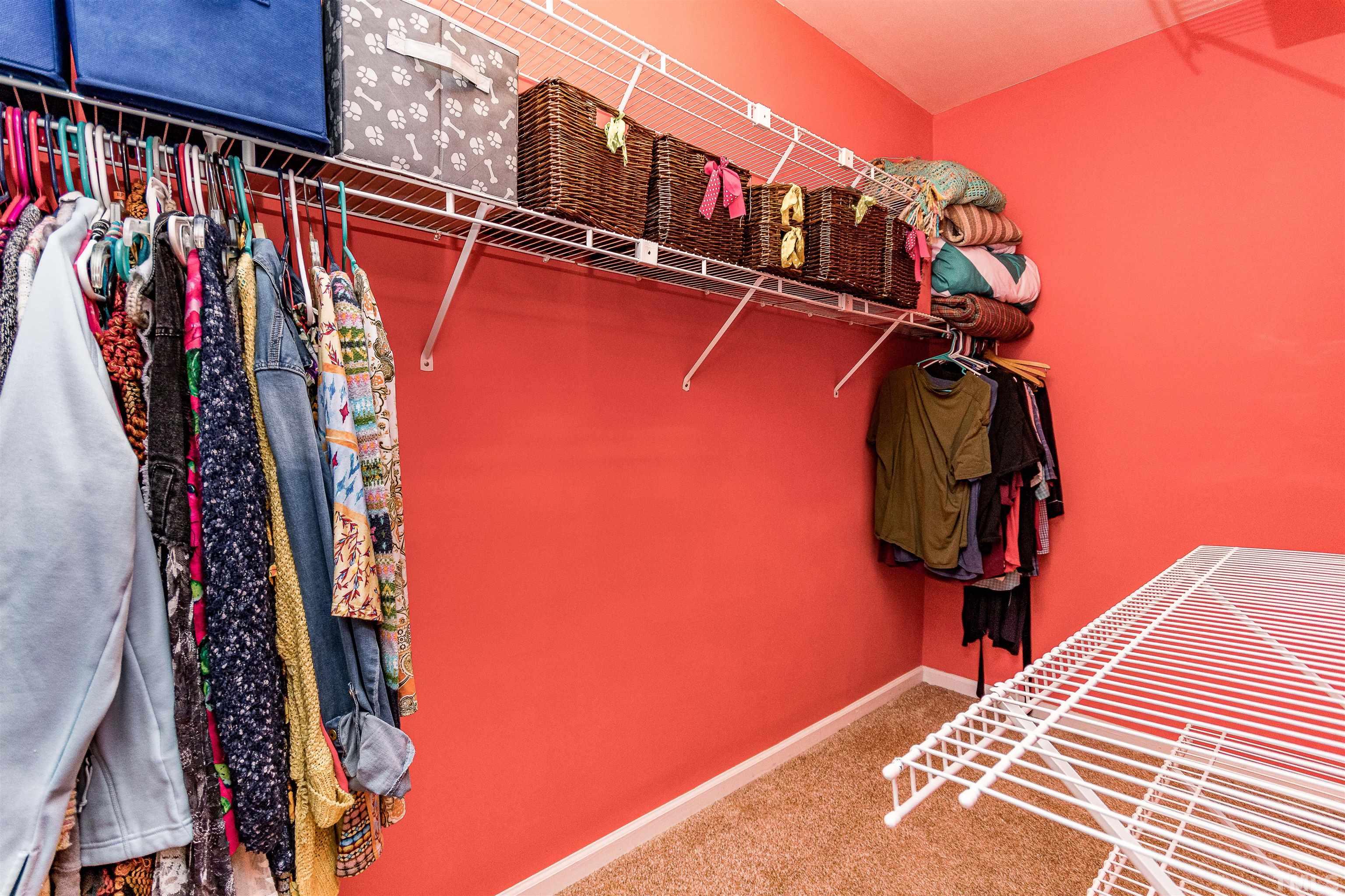 5405 Neuse Forest Road Raleigh, NC 27616 - Photo 23 of 31 a view of walk in closet with clothes and shoes