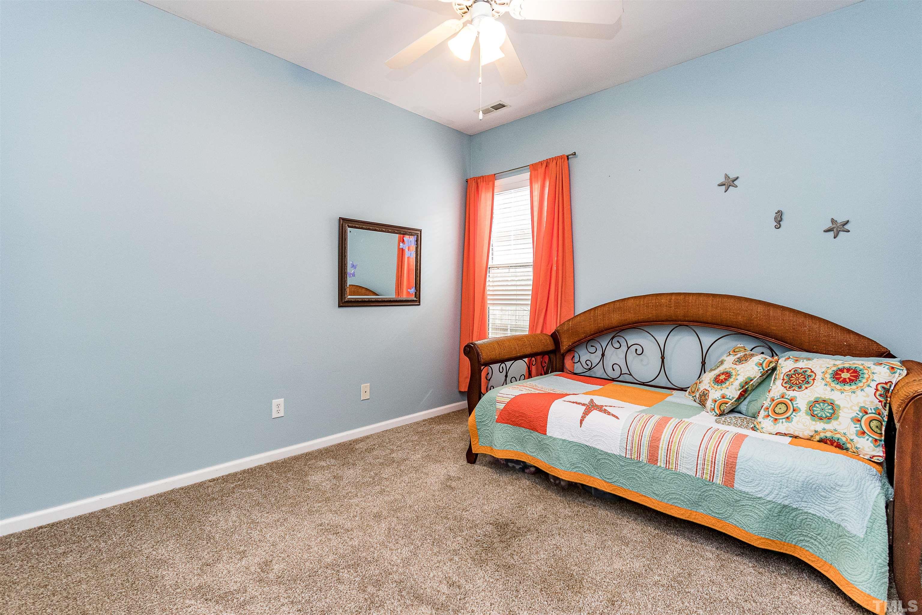 5405 Neuse Forest Road Raleigh, NC 27616 - Photo 30 of 31 a bedroom with a bed and a window
