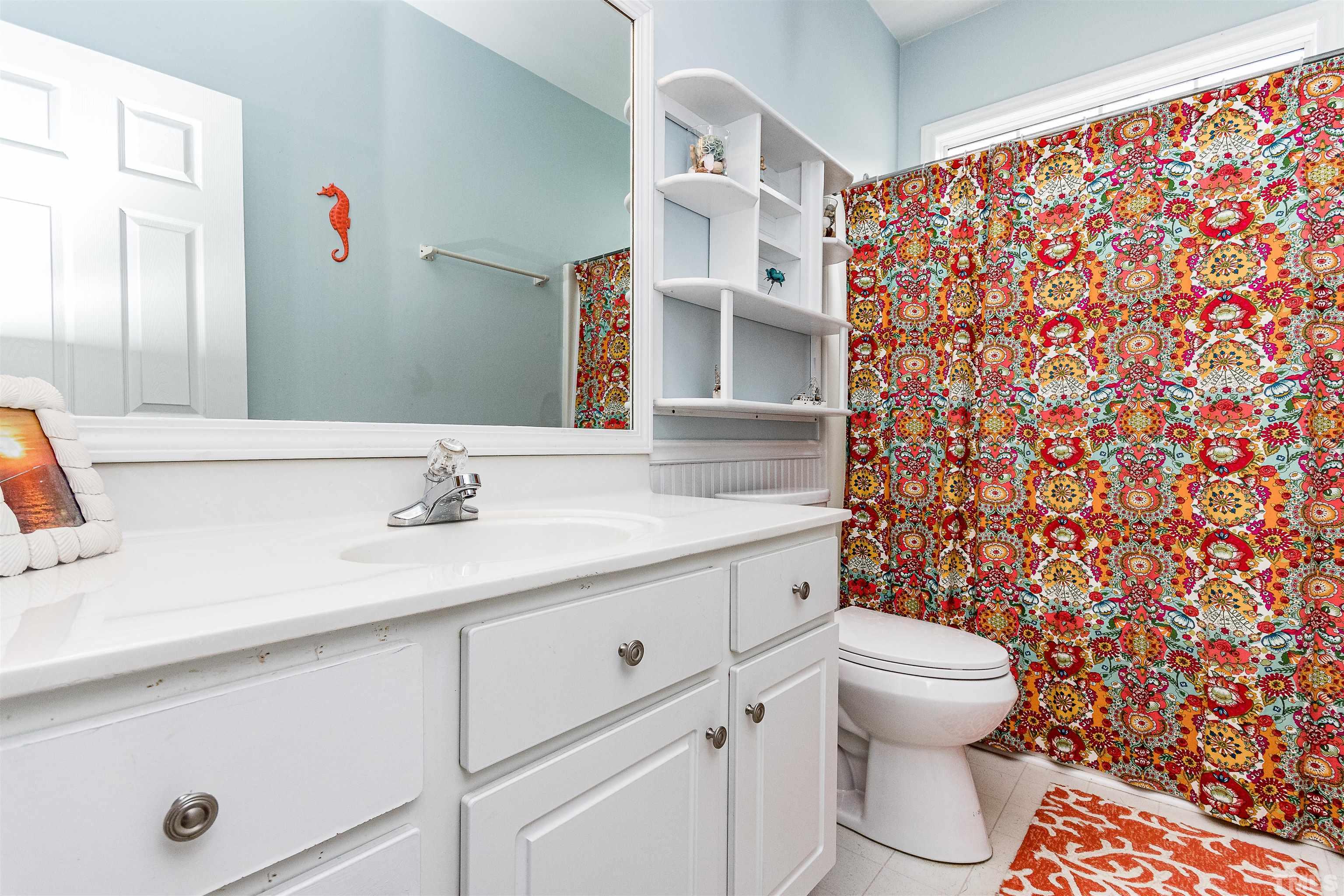5405 Neuse Forest Road Raleigh, NC 27616 - Photo 31 of 31 a bathroom with a sink toilet and shower