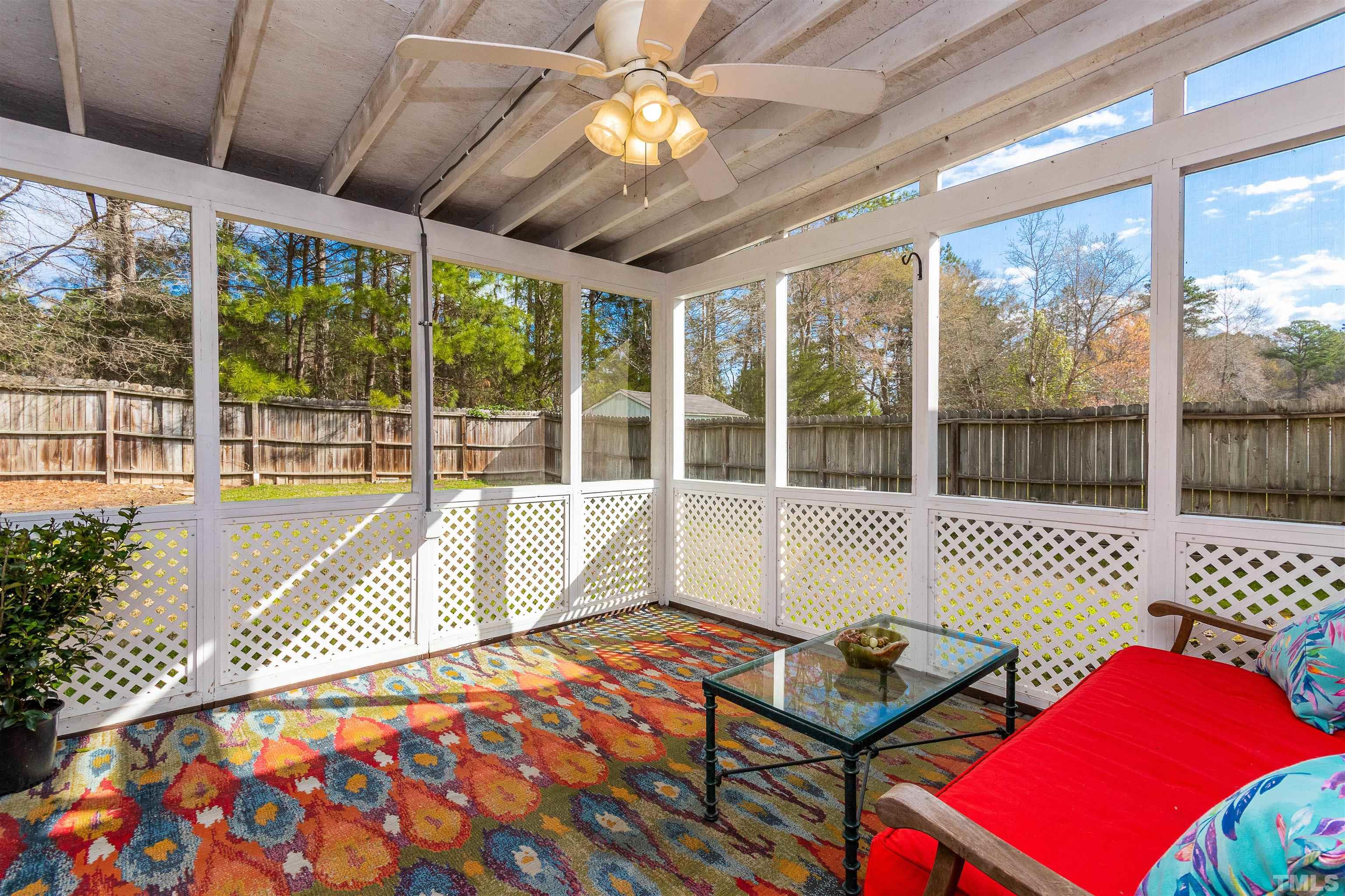 5405 Neuse Forest Road Raleigh, NC 27616 - Photo 5 of 31 a living room with furniture and a floor to ceiling window
