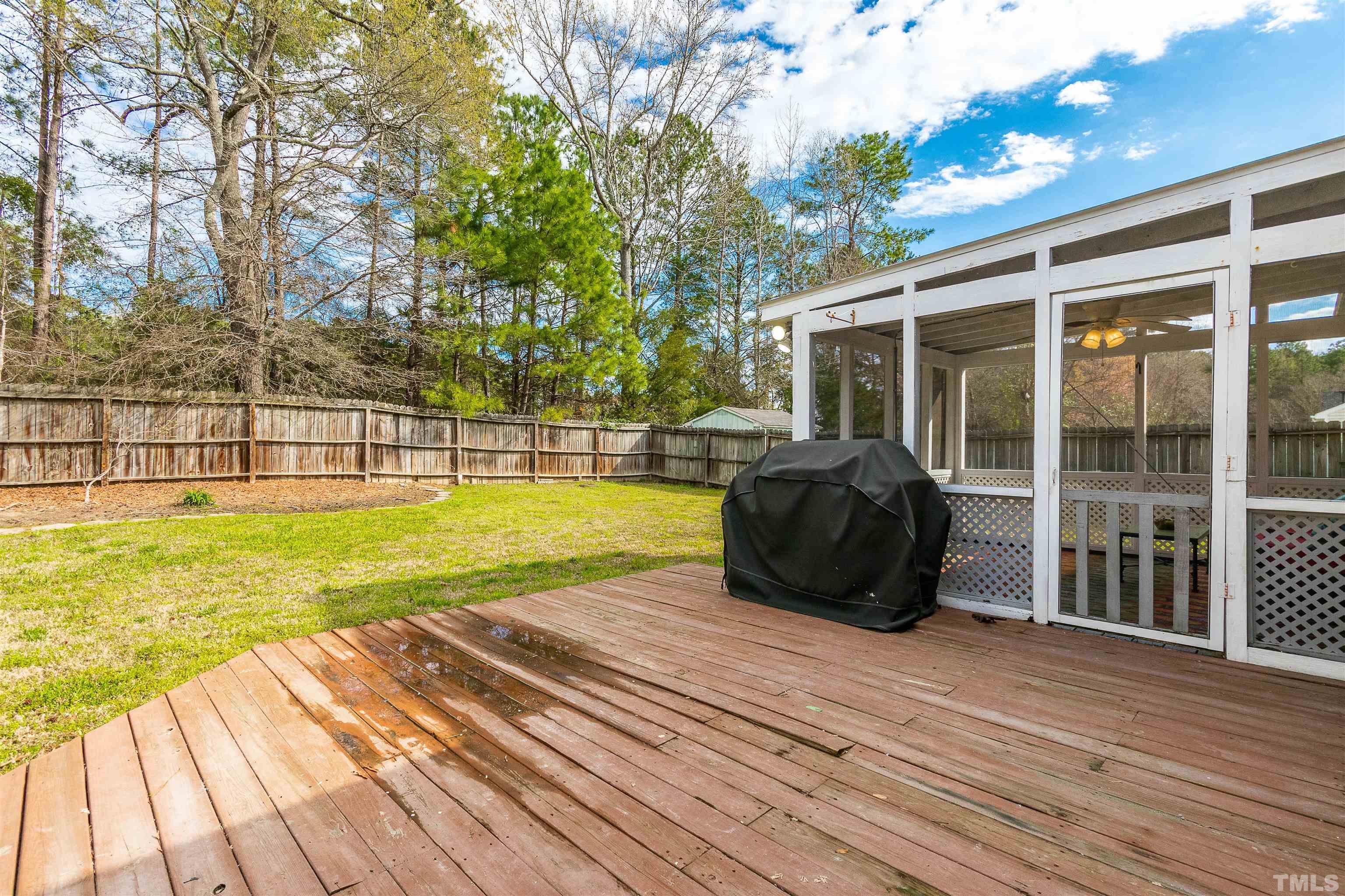 5405 Neuse Forest Road Raleigh, NC 27616 - Photo 7 of 31 a view of a house with backyard and porch