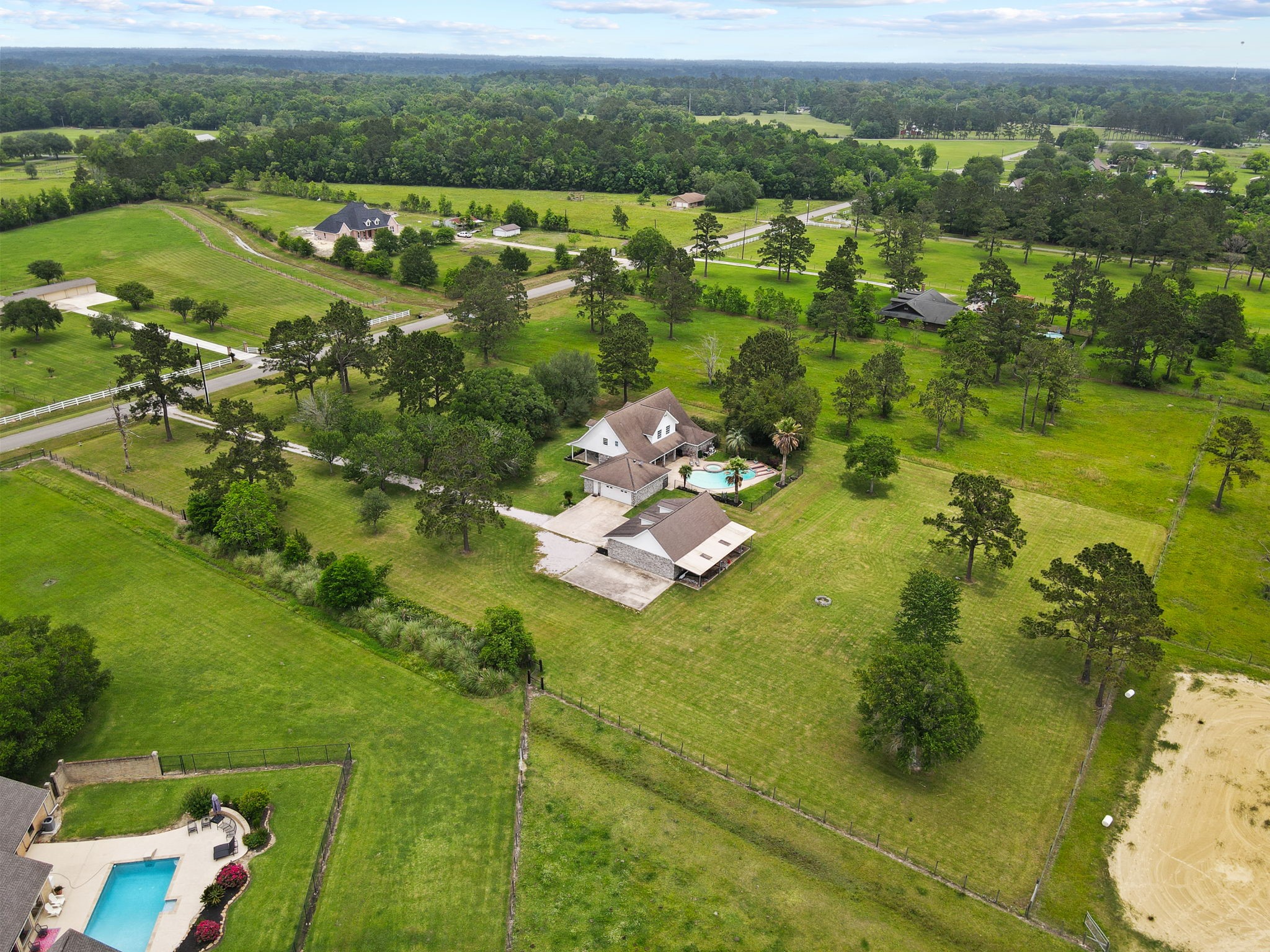 16421 Westbury Road Beaumont, TX 77713 - Photo 1 of 29 a view of a lake with a houses