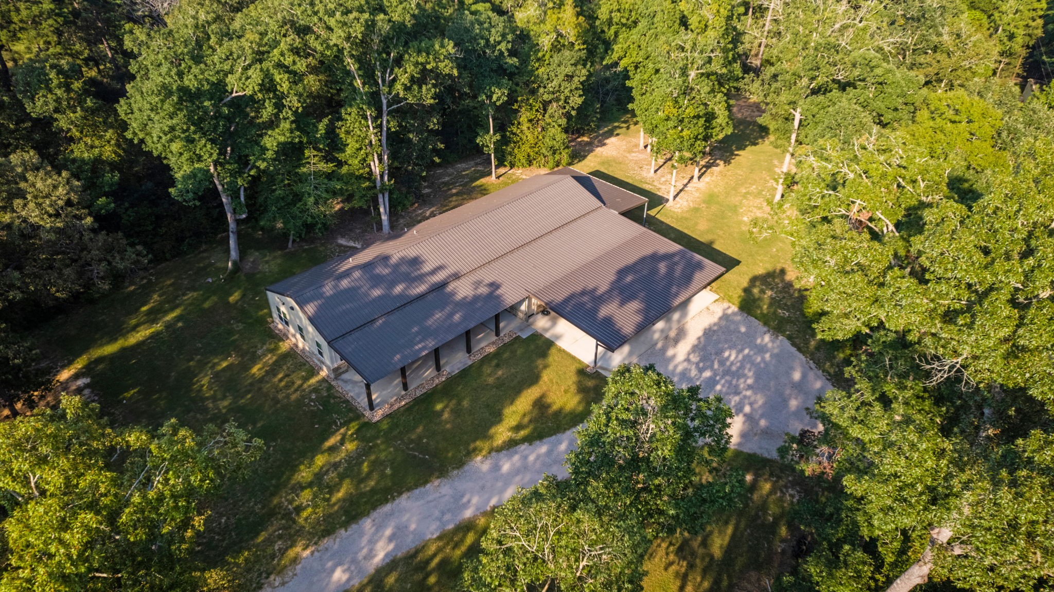 6970 Longmire Road Conroe, TX 77304 - Photo 12 of 48 a view of a house with a yard