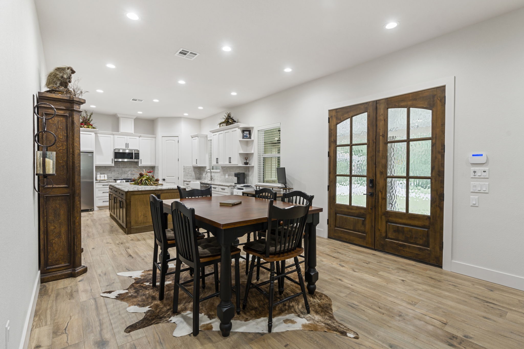 6970 Longmire Road Conroe, TX 77304 - Photo 15 of 48 a view of a dining room with furniture window and wooden floor