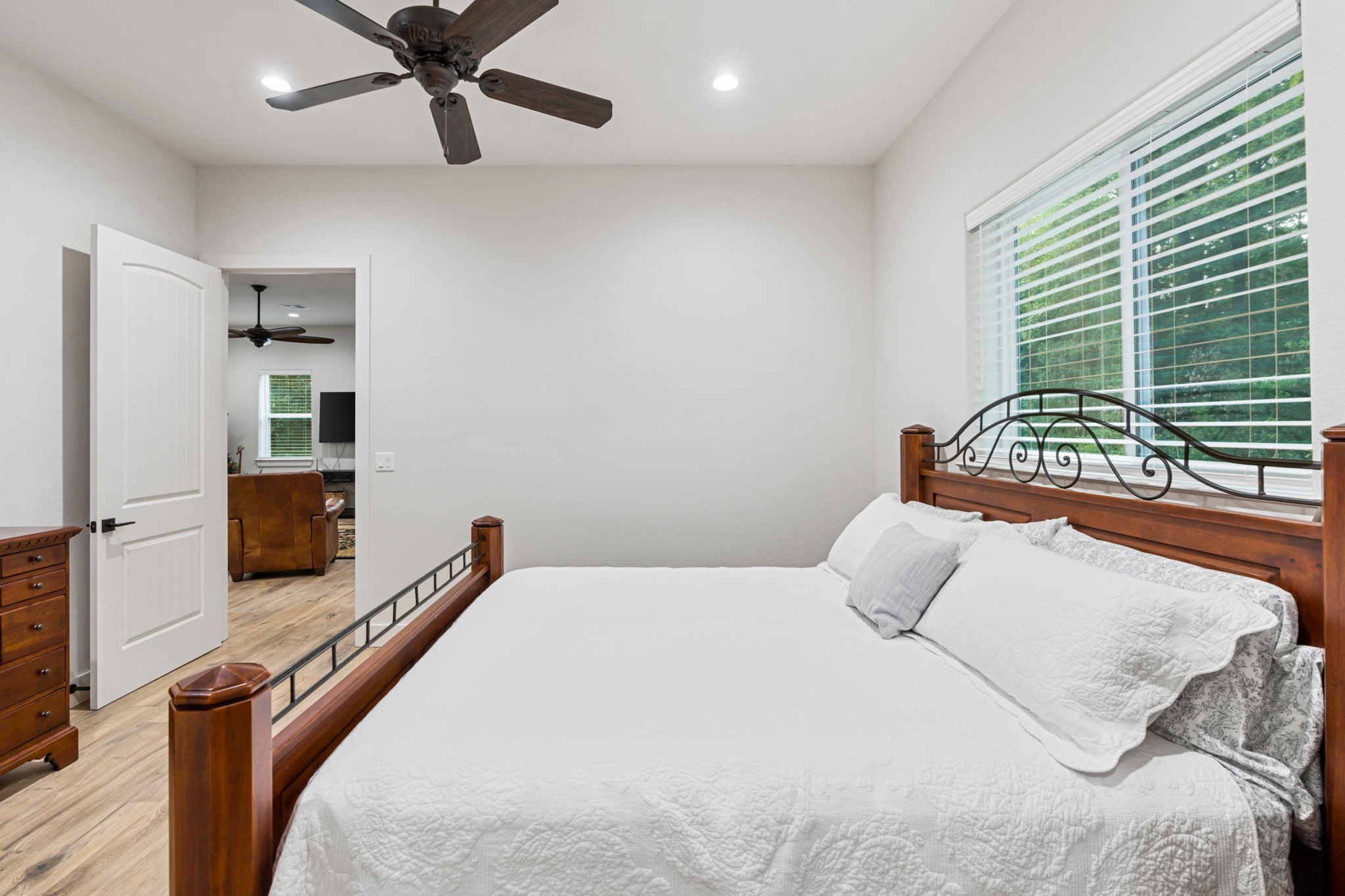 6970 Longmire Road Conroe, TX 77304 - Photo 26 of 48 a bedroom with a bed and a television