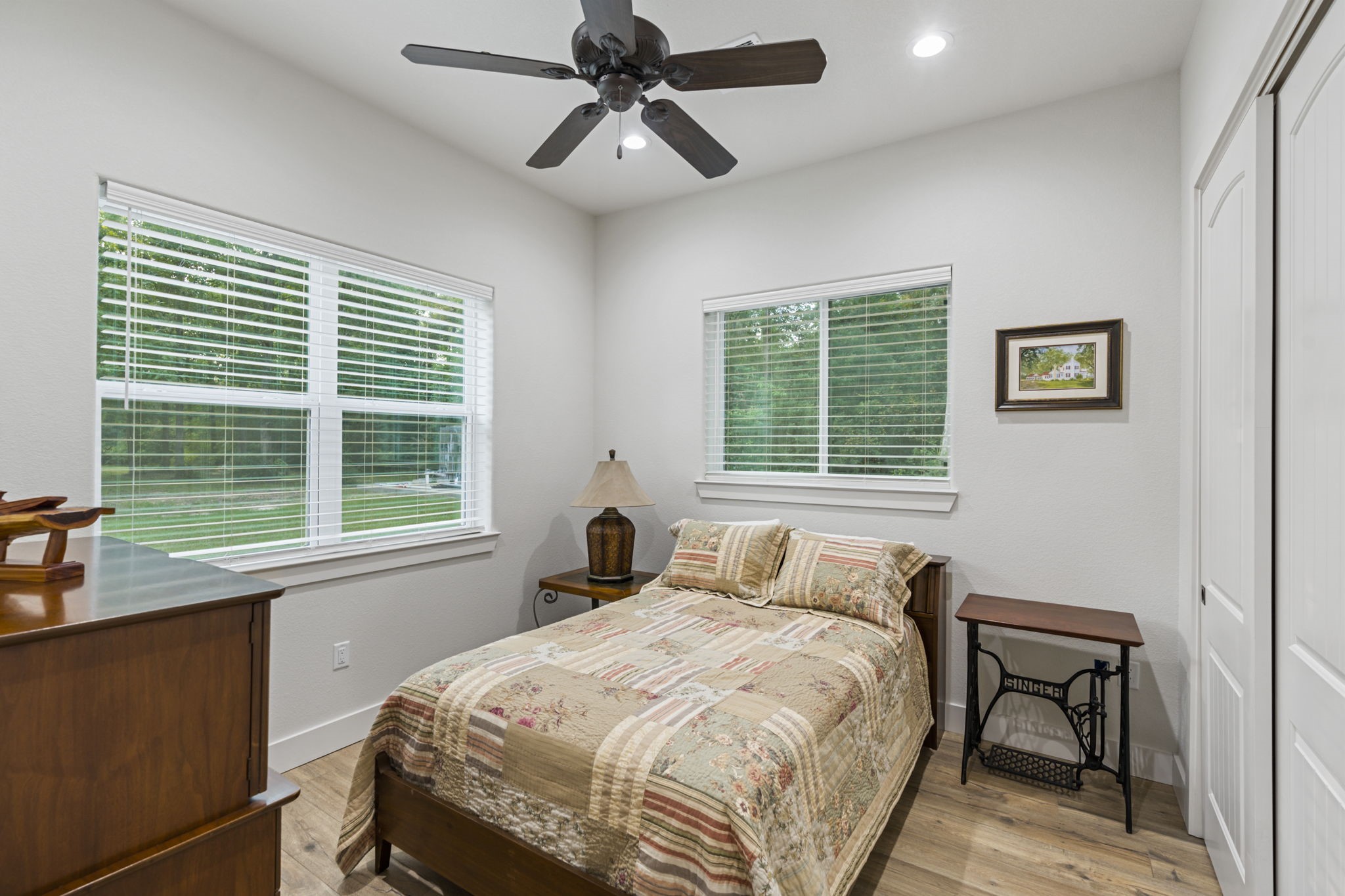 6970 Longmire Road Conroe, TX 77304 - Photo 30 of 48 a bedroom with a bed windows and a window