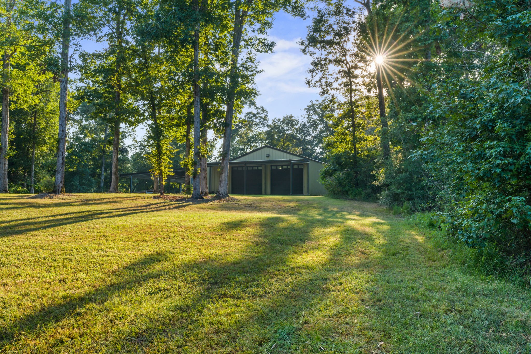 6970 Longmire Road Conroe, TX 77304 - Photo 3 of 48 a view of a swimming pool with an outdoor space