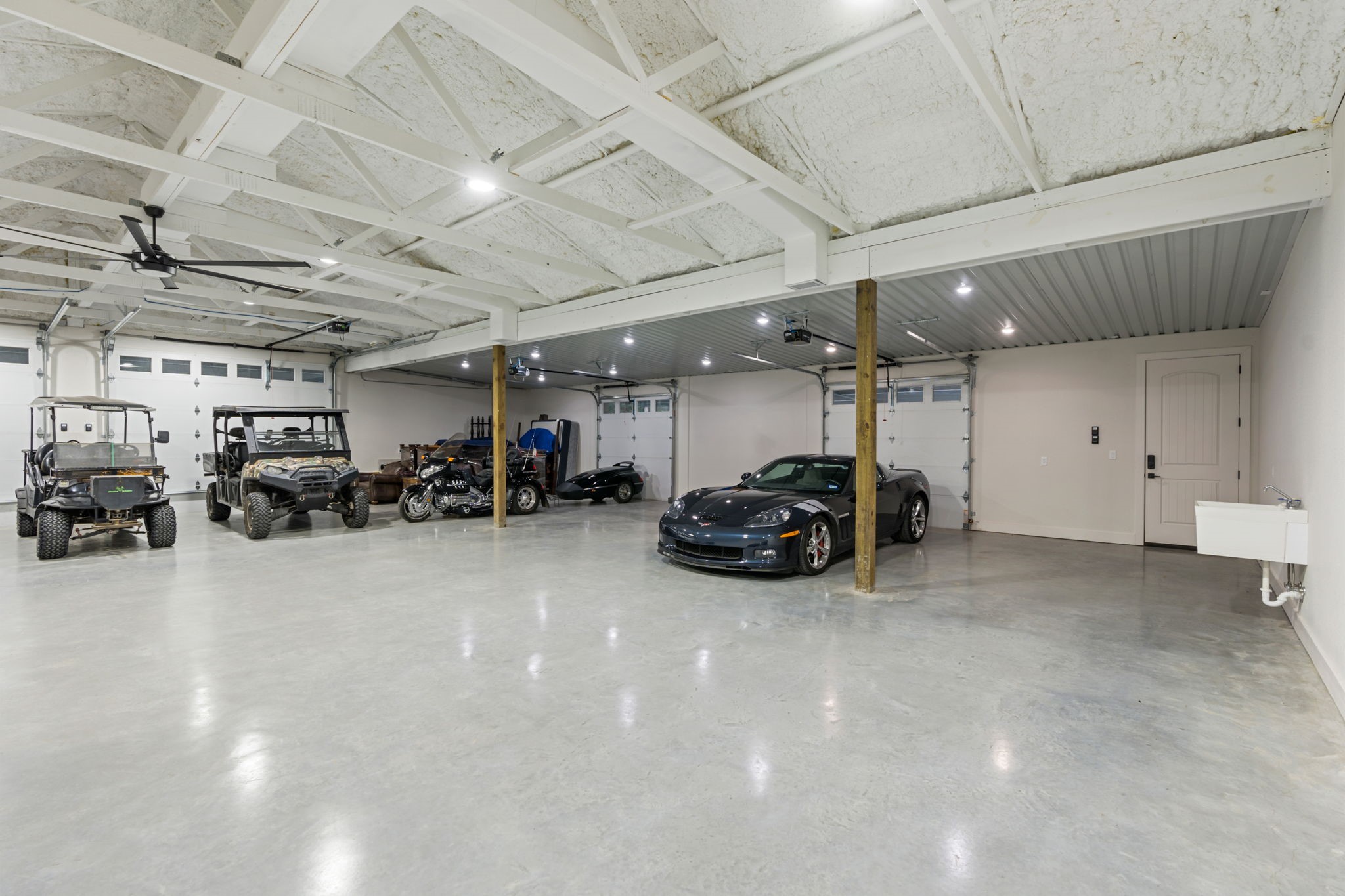6970 Longmire Road Conroe, TX 77304 - Photo 35 of 48 a view of parking garage with cars