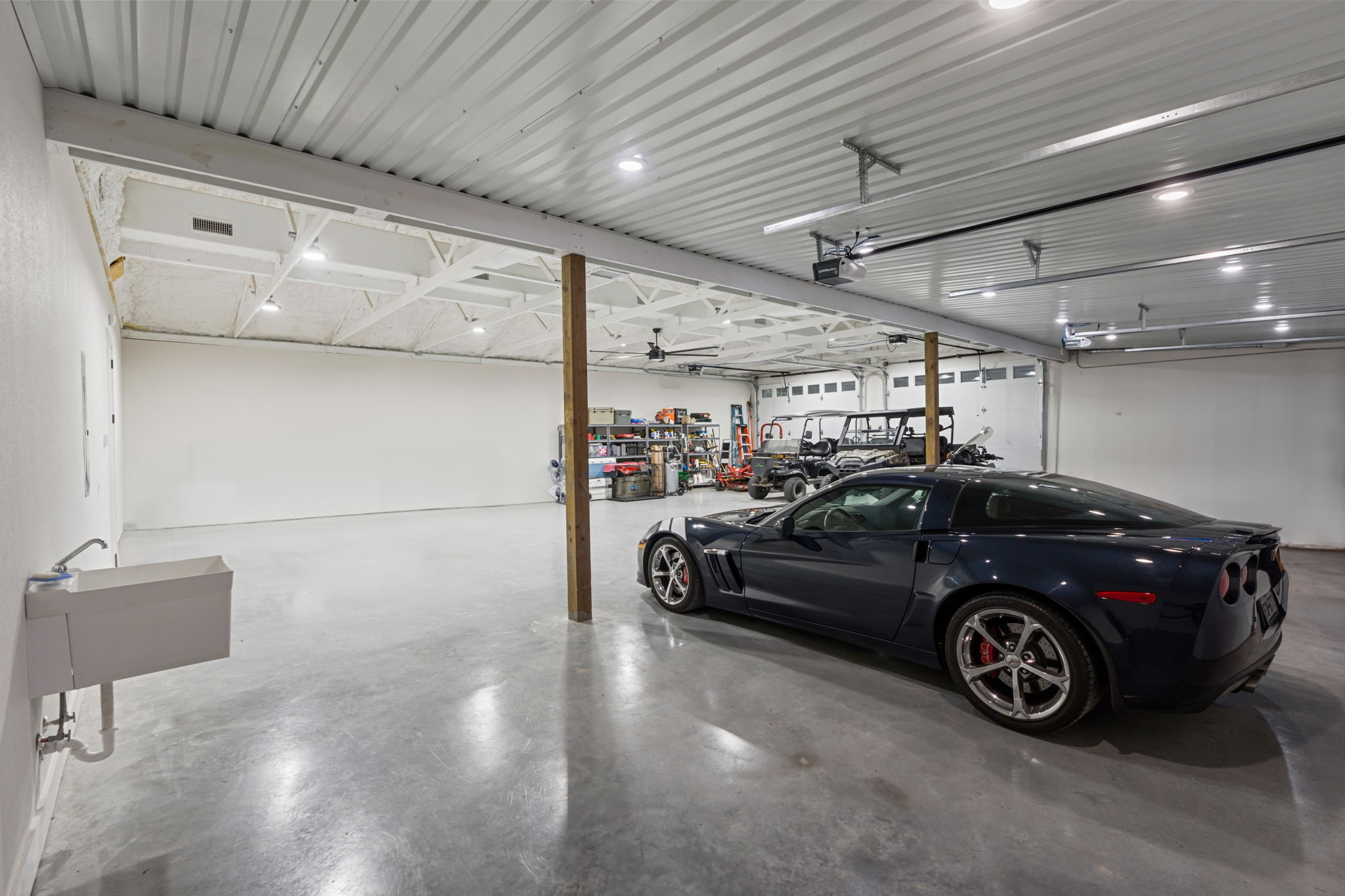 6970 Longmire Road Conroe, TX 77304 - Photo 37 of 48 a car parked in a garage