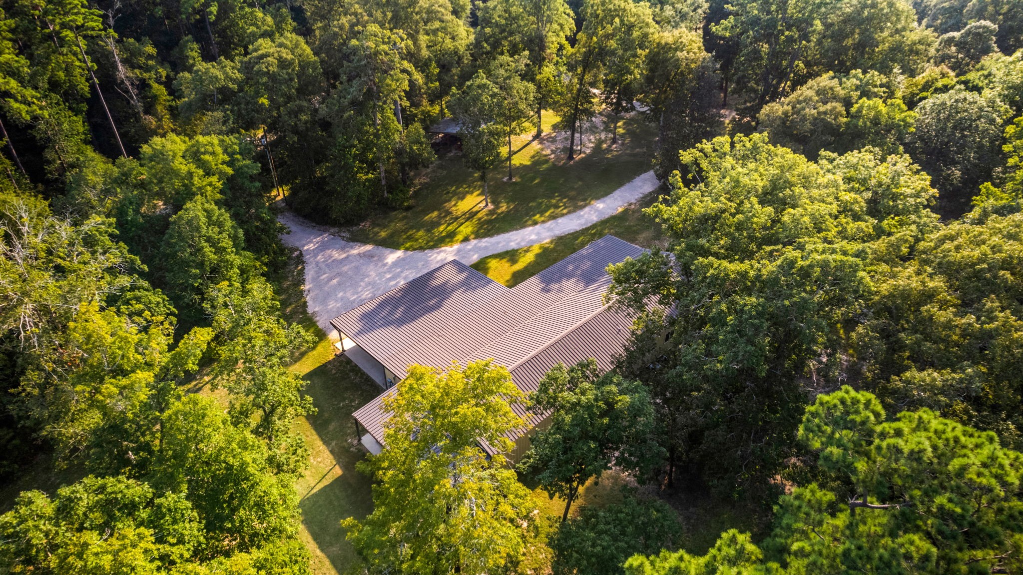 6970 Longmire Road Conroe, TX 77304 - Photo 8 of 48 a view of a park with plants and trees