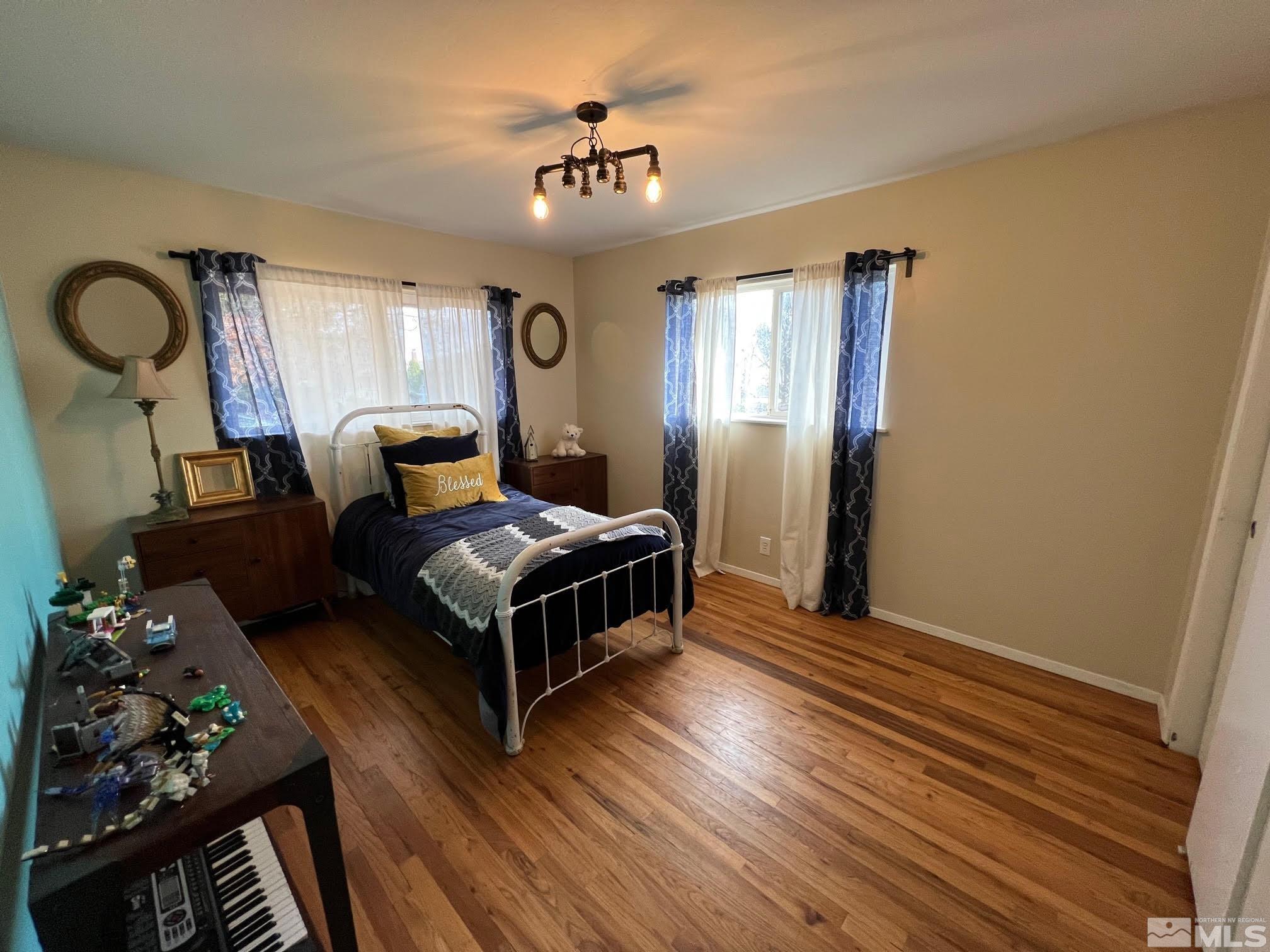 2140 Arcane Avenue Reno, NV 89503 - Photo 13 of 15 a living room with furniture and a chandelier