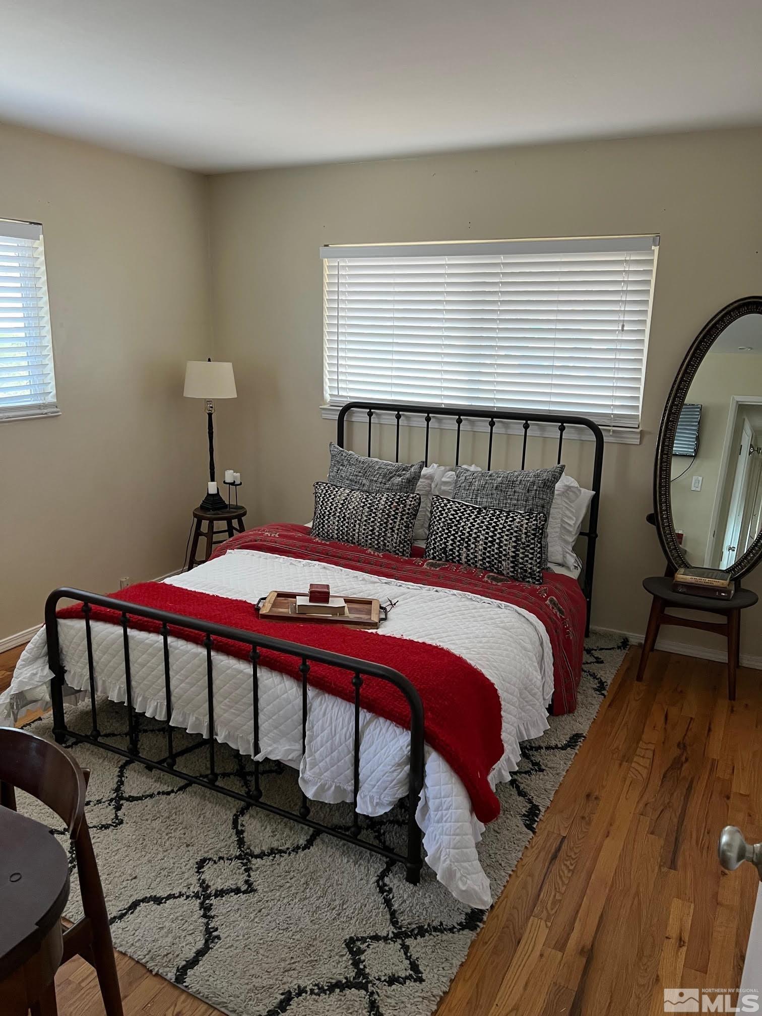 2140 Arcane Avenue Reno, NV 89503 - Photo 15 of 15 a bedroom with a bed a mirror and desk