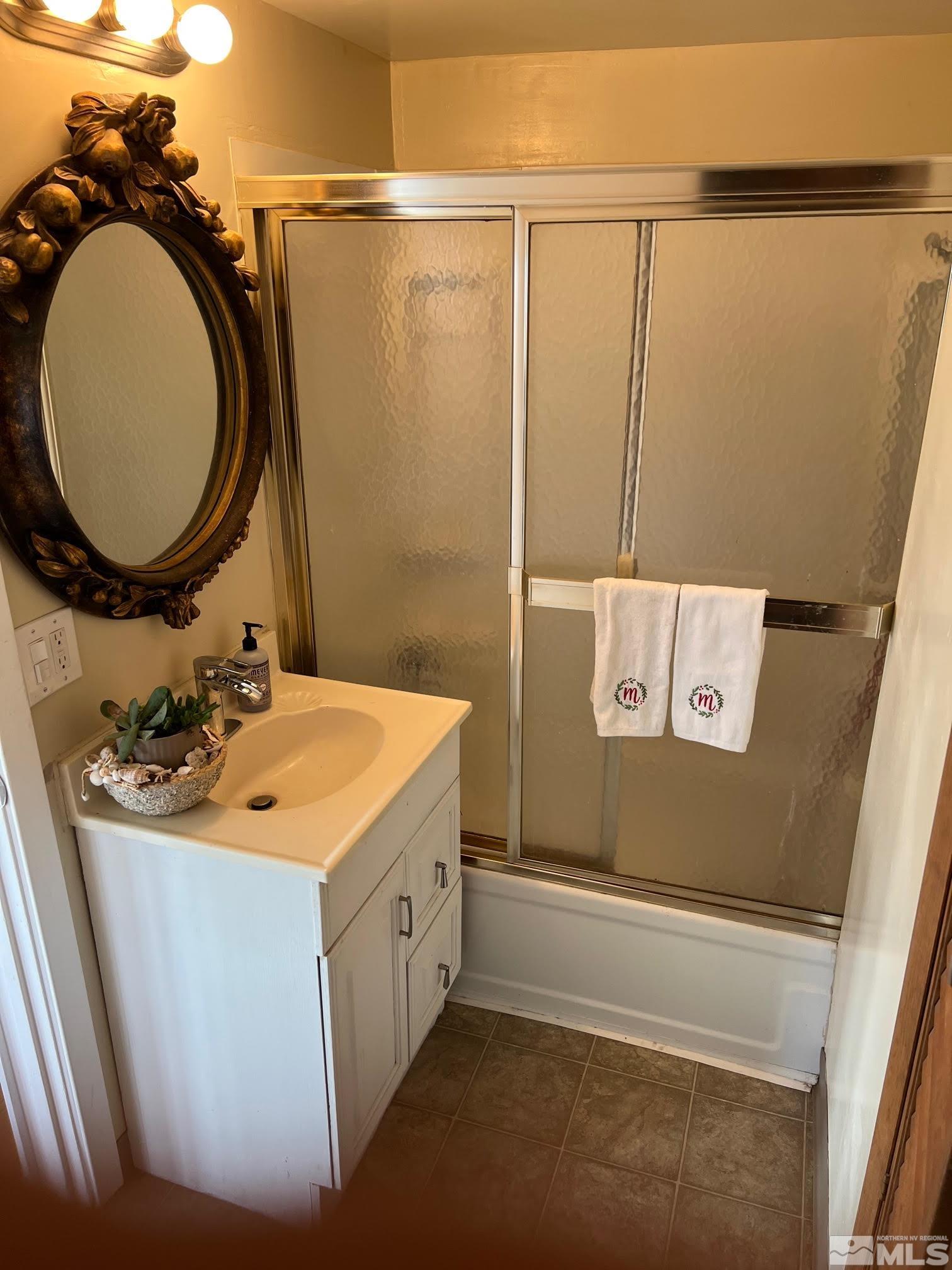 2140 Arcane Avenue Reno, NV 89503 - Photo 4 of 15 a bathroom with a sink and a mirror