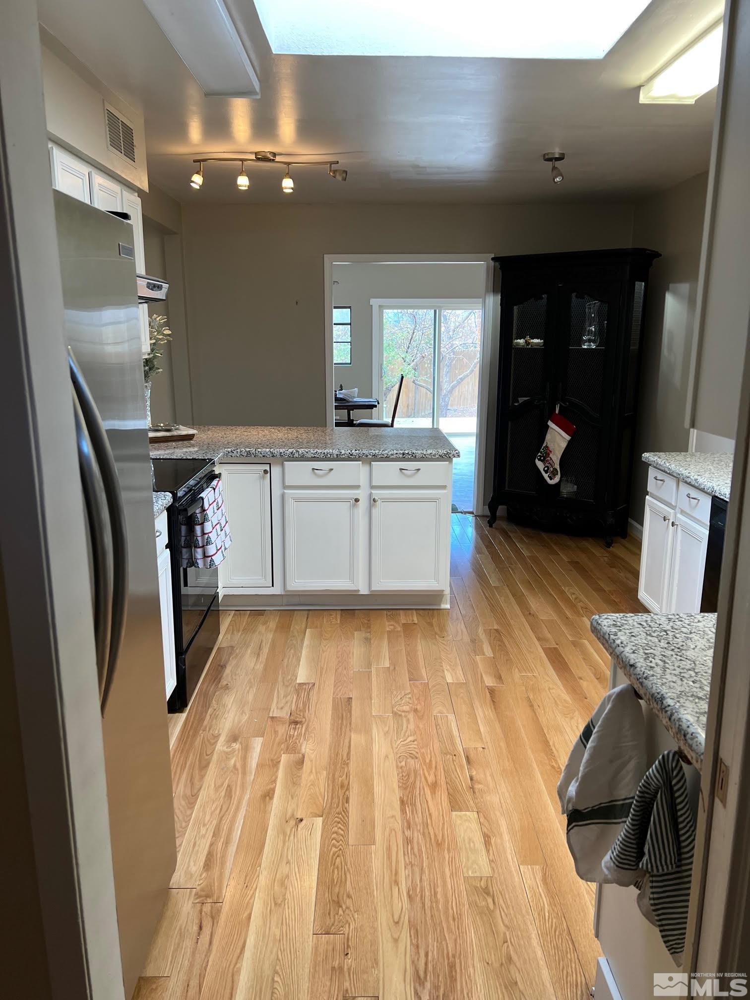 2140 Arcane Avenue Reno, NV 89503 - Photo 7 of 15 a kitchen with stainless steel appliances granite countertop a refrigerator and a sink