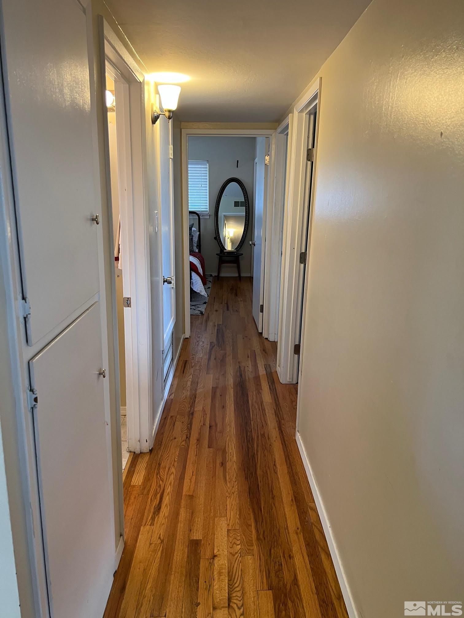2140 Arcane Avenue Reno, NV 89503 - Photo 8 of 15 a view of a hallway with wooden floor