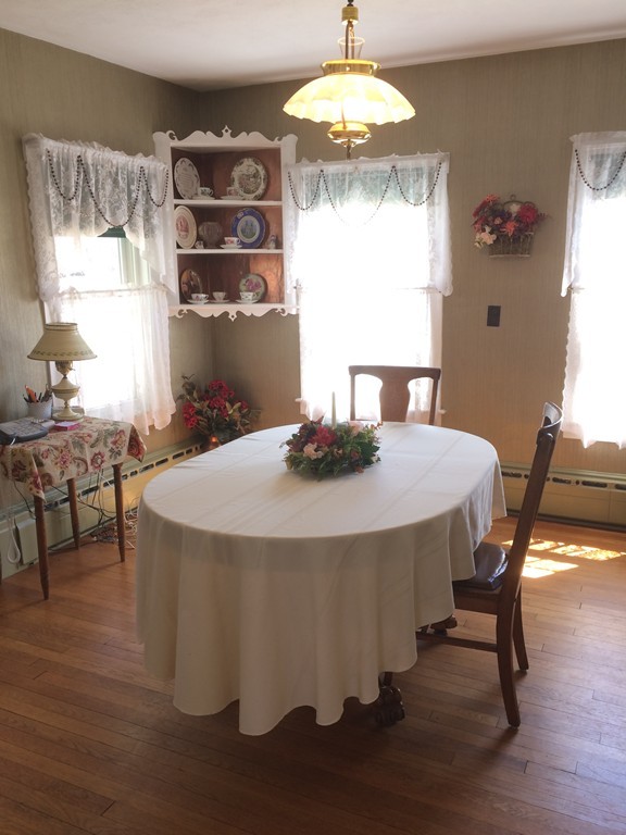 100 Leshure Road Rowe, MA 01367 - Photo 12 of 30 a dining room with furniture a chandelier and window