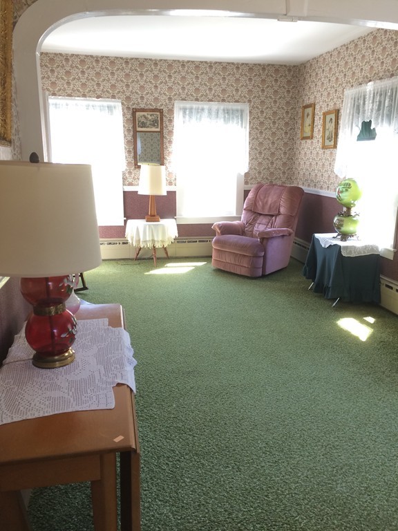 100 Leshure Road Rowe, MA 01367 - Photo 15 of 30 a living room with furniture and a fireplace