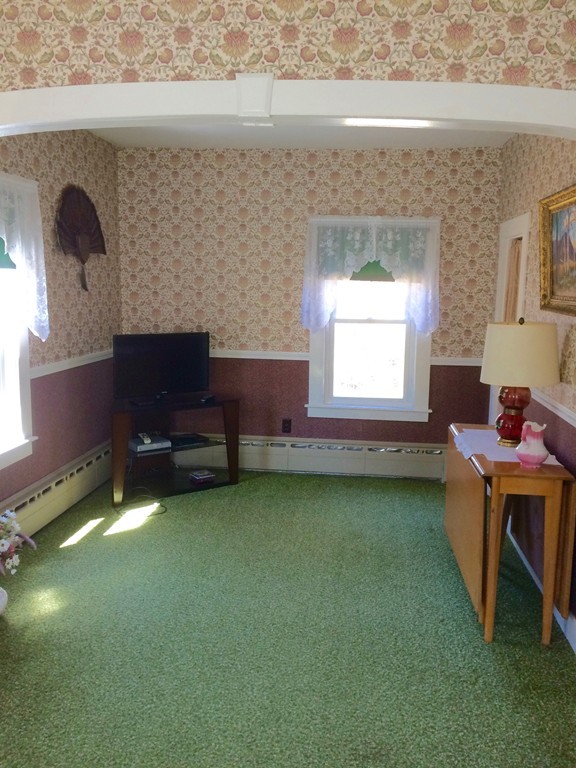 100 Leshure Road Rowe, MA 01367 - Photo 17 of 30 a room with a chair and a window