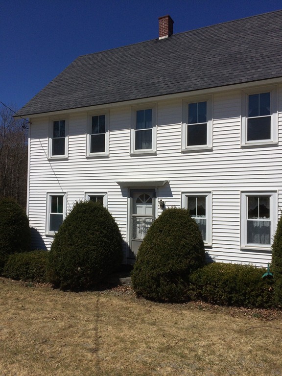 100 Leshure Road Rowe, MA 01367 - Photo 2 of 30 a view of a house with a yard and garage