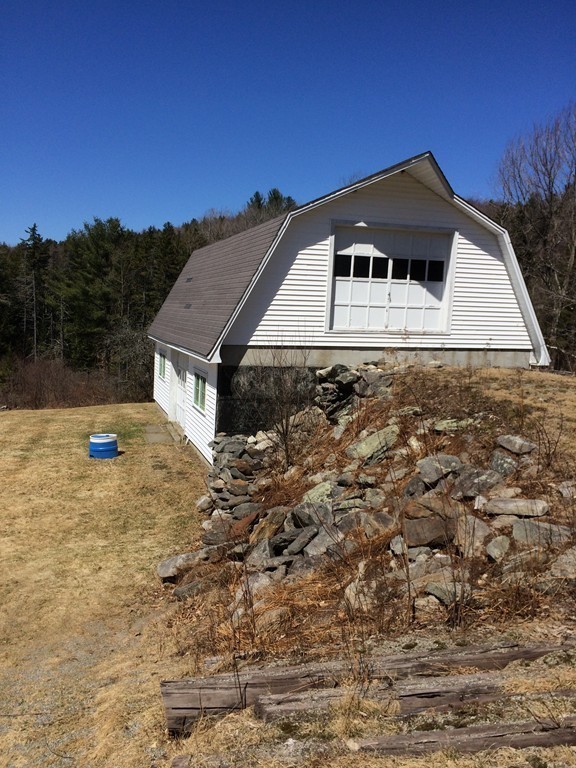 100 Leshure Road Rowe, MA 01367 - Photo 28 of 30 a front view of a house with a yard