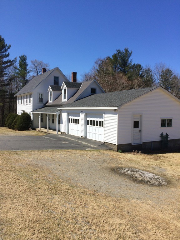 100 Leshure Road Rowe, MA 01367 - Photo 4 of 30 a front view of a house with a yard