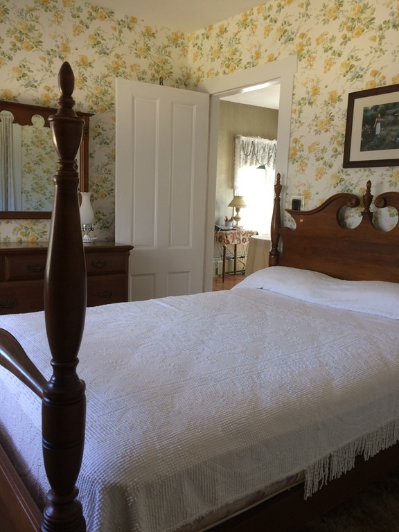 100 Leshure Road Rowe, MA 01367 - Photo 9 of 30 a bedroom with a bed and a view of balcony