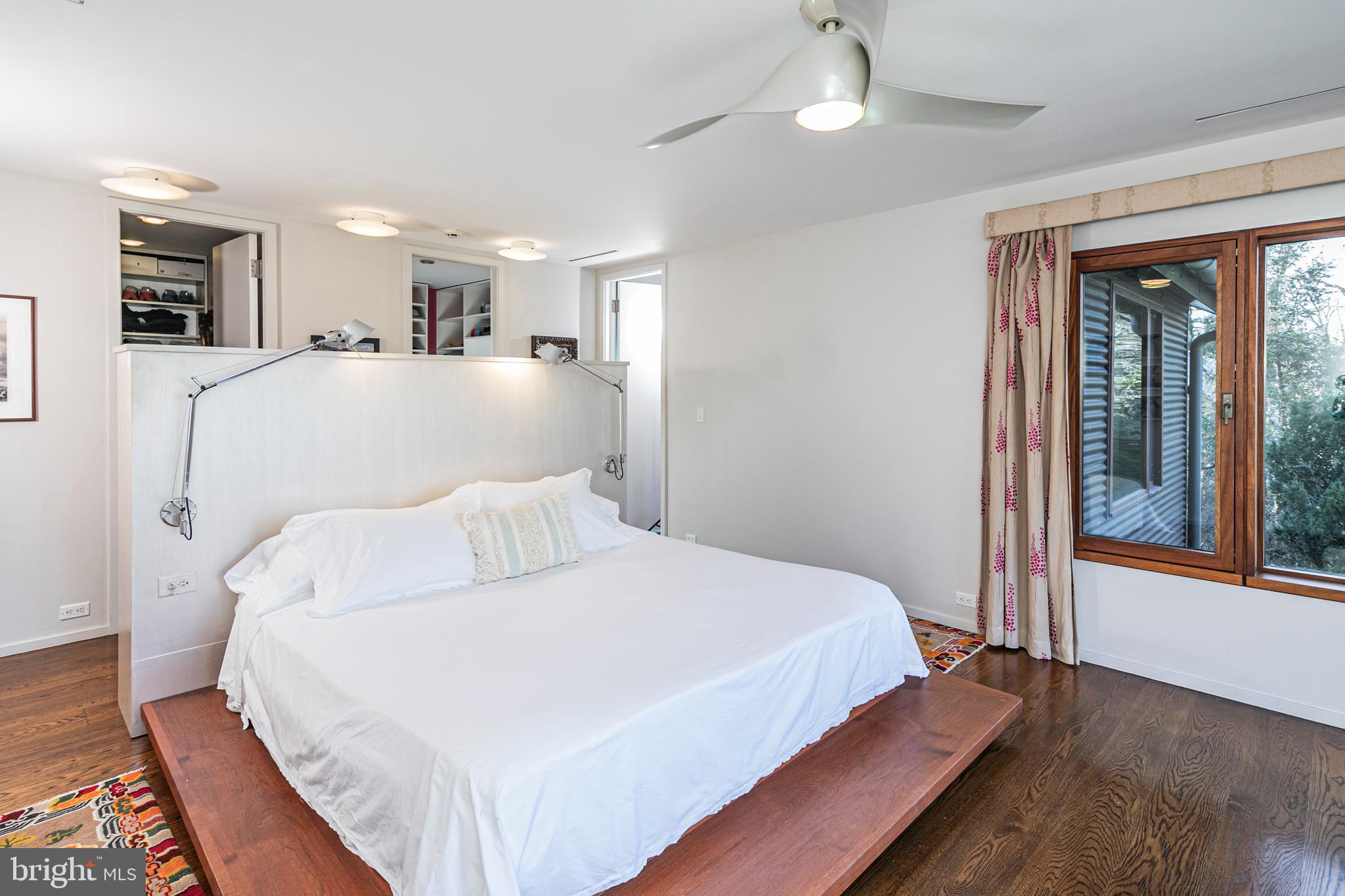 113 Westcott Road Princeton, NJ 08540 - Photo 17 of 36 a large bedroom with a large bed chandelier and a window