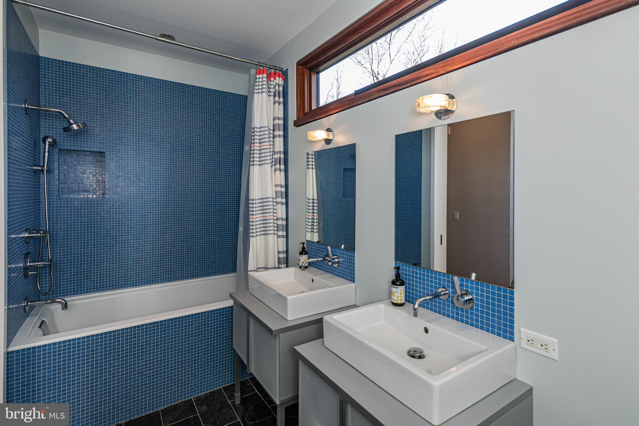 113 Westcott Road Princeton, NJ 08540 - Photo 30 of 36 a bathroom with a tub sink and mirror