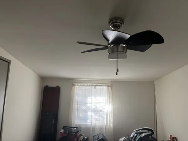 a bedroom with furniture and a bed