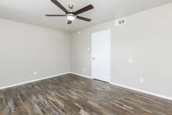 a view of walk in closet with empty racks