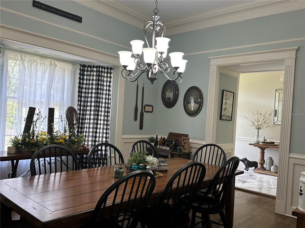 708 East Main Street Wauchula, FL 33873 - Photo 12 of 82 a view of a dining room with furniture and chandelier