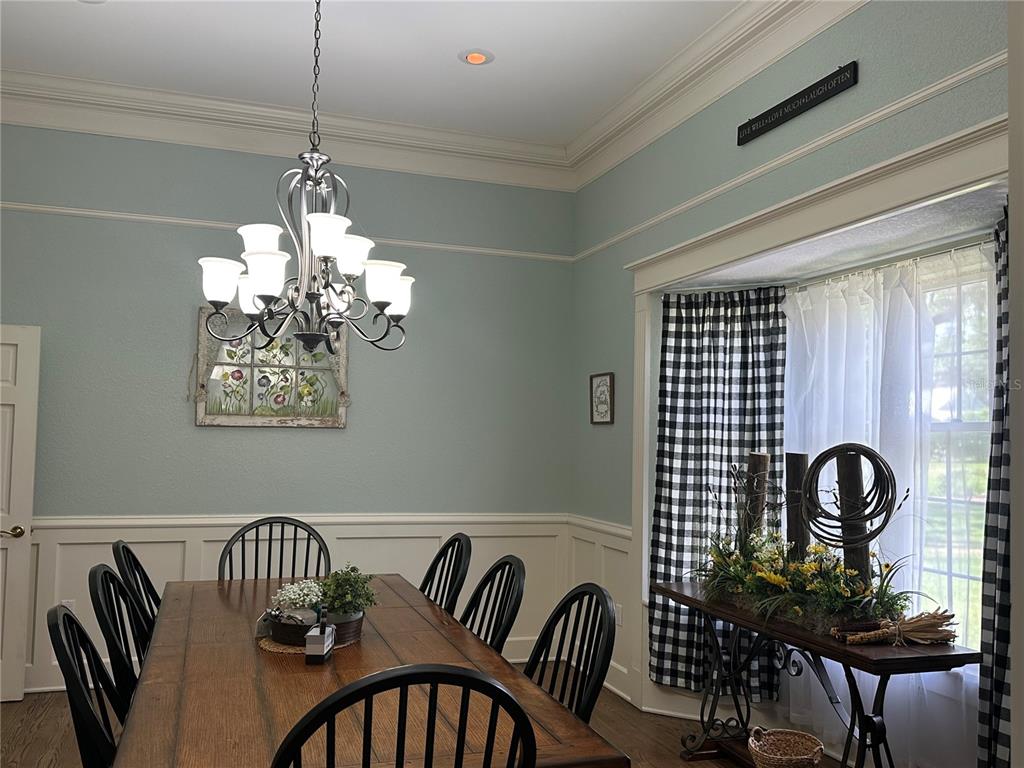 708 East Main Street Wauchula, FL 33873 - Photo 13 of 82 a view of a dining room with furniture and chandelier